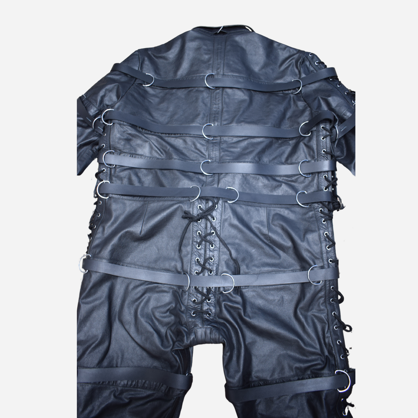 Black Genuine Leather durable set features an adjustable belt, detachable chest flaps, and a laced closure.