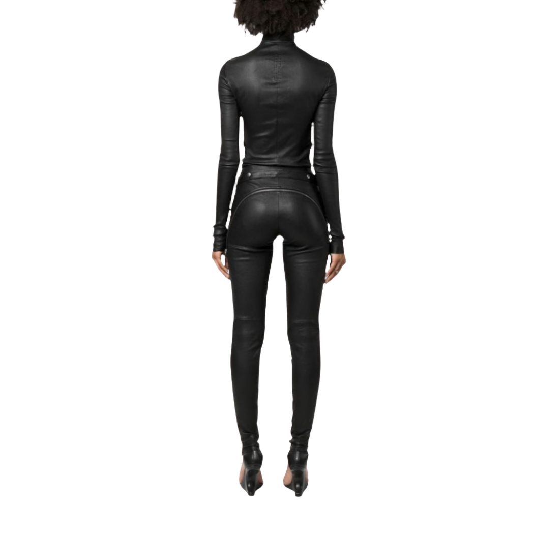 Elevate your style with our Chic genuine Leather Jumpsuit featuring a crew neck and YKK zipper closure on the front. This fitted genuine leather catsuit includes waist belt eyelet details for added flair.