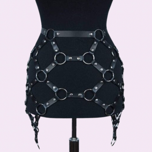 our Genuine Leather Harness Skirt featuring silver hardware.   Handmade with premium stitching, this chic skirt is perfect for music festivals.