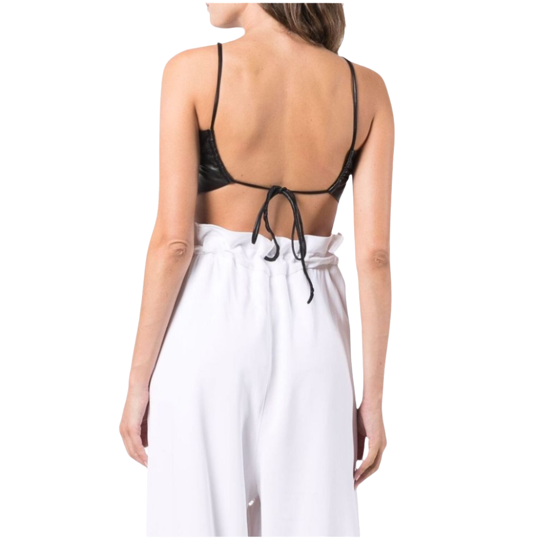our Genuine Leather Butterfly Crop Top featuring a ruched middle design, criss-cross front straps, and an exclusive backless style. Elevate your look with this unique and chic leather crop top.