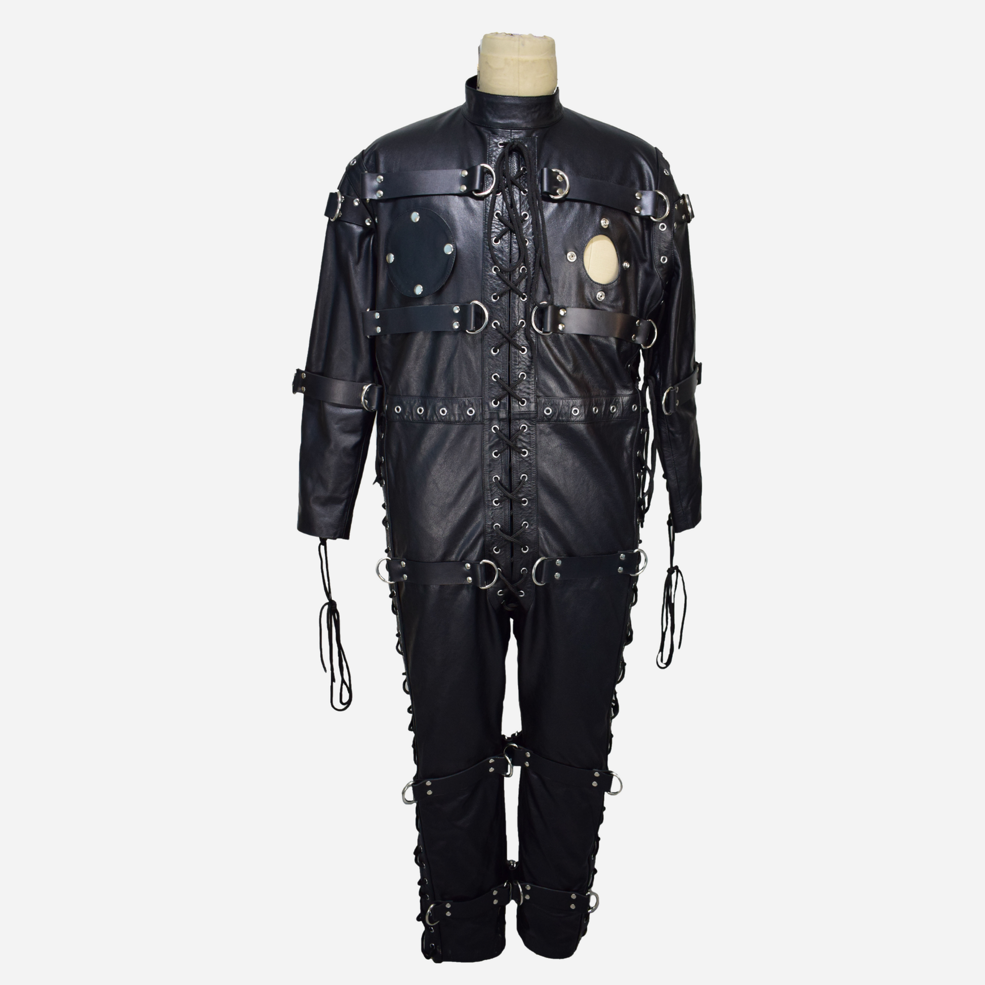 Black Genuine Leather catsuit with lace up front, opened chest flaps and zipper fastening back.