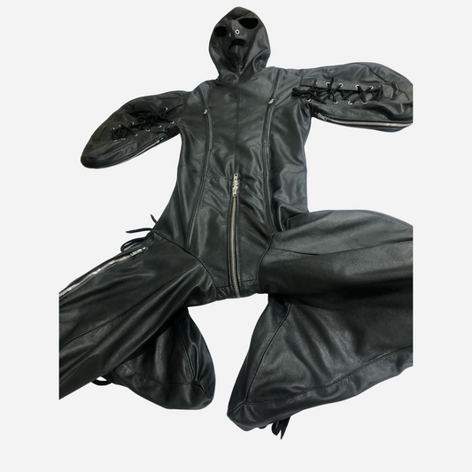 Explore our Real Leather Sleepsack with Hood Mask and Lacing. Designed for intense sensory play, it includes adjustable arm and leg binders, a two-way zipper, and steel boned support. Ideal for those seeking durable, high-quality bondage gear. Order now for an unforgettable experience!