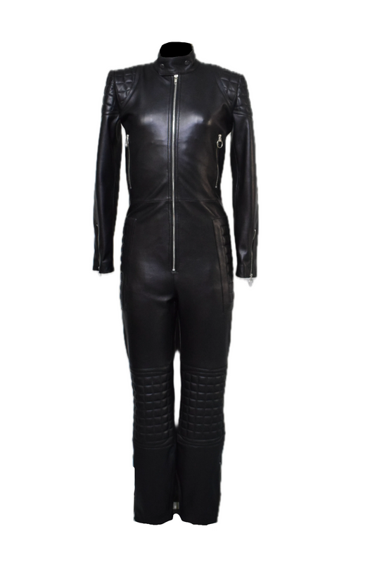 Black leather women’s jumpsuit with quilted panels on shoulders, elbows, knees, and hips, front and mid-back YKK zippers, ankle and wrist zippers, and waist pockets.