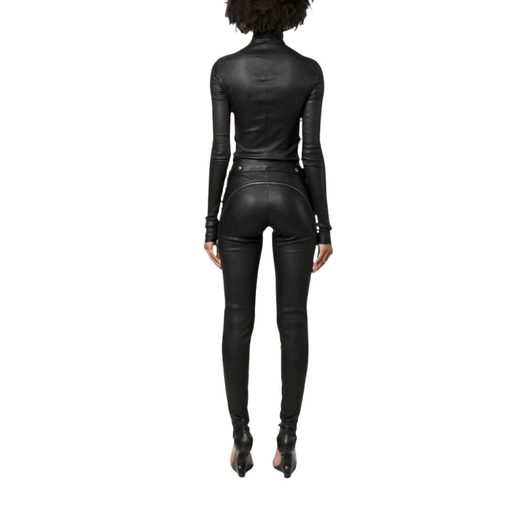 Elevate your style with our Chic genuine Leather Jumpsuit featuring a crew neck and YKK zipper closure on the front. This fitted genuine leather catsuit includes waist belt eyelet details for added flair. 