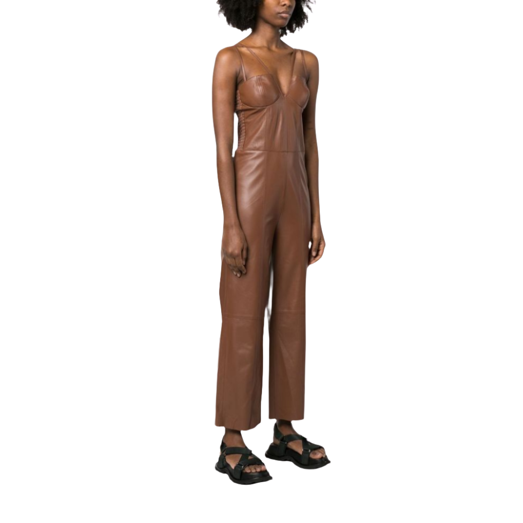 our Matilda Brown Leather Jumpsuit, featuring dual spaghetti straps, flare bottoms, and a slim-fit top with a deep V-neck. Crafted from smooth leather for a sleek and comfortable feel, this jumpsuit has a ruched back for better fitting and is handmade with premium stitching and cutting for superior quality