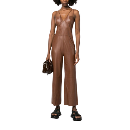 our Matilda Brown Leather Jumpsuit, featuring dual spaghetti straps, flare bottoms, and a slim-fit top with a deep V-neck. Crafted from smooth leather for a sleek and comfortable feel, this jumpsuit has a ruched back for better fitting and is handmade with premium stitching and cutting for superior quality