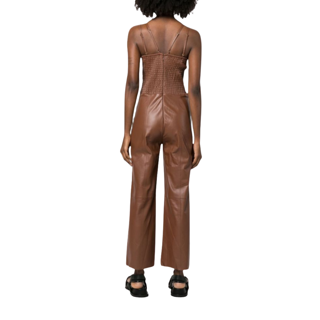 our Matilda Brown Leather Jumpsuit, featuring dual spaghetti straps, flare bottoms, and a slim-fit top with a deep V-neck. Crafted from smooth leather for a sleek and comfortable feel, this jumpsuit has a ruched back for better fitting and is handmade with premium stitching and cutting for superior quality